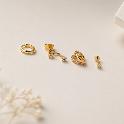 gold earrings flatlay