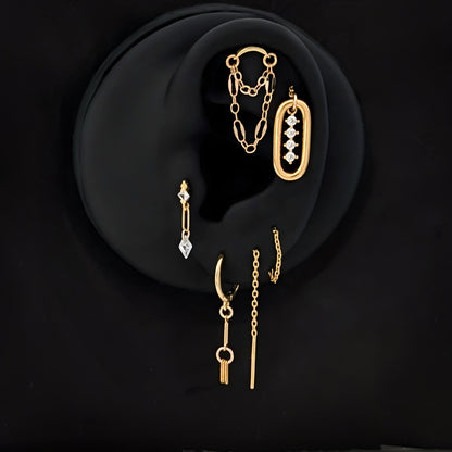 Ørepynt sett av 4 øredobber i gull curated øre