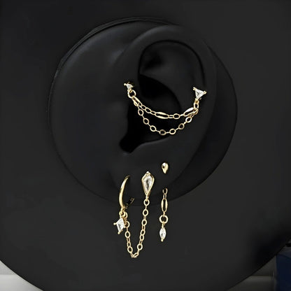 ørepynt sett av 5 øredobber i gull